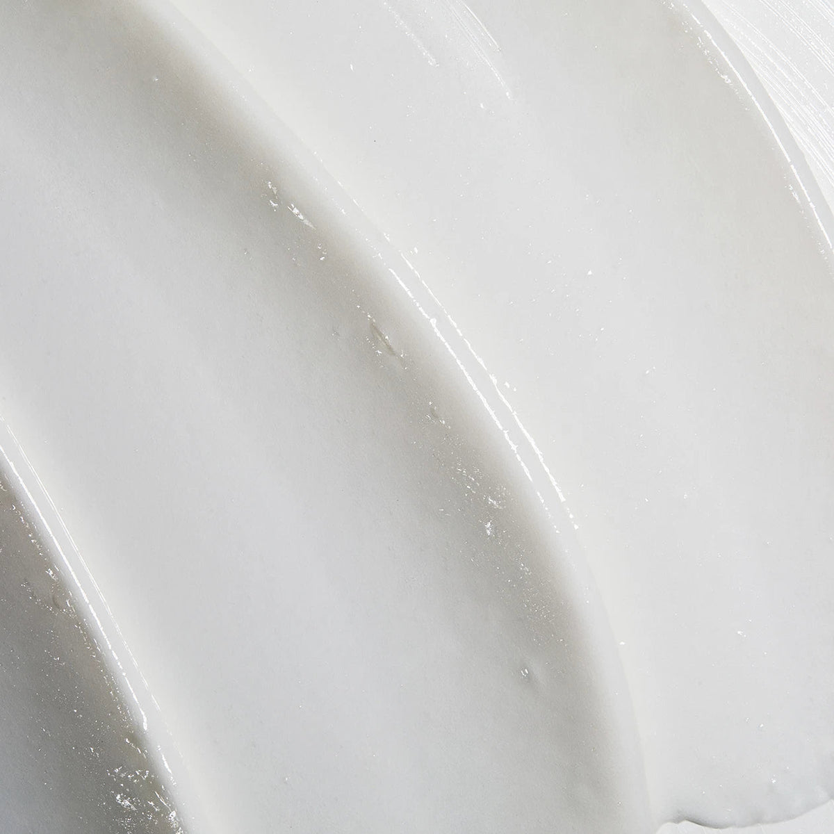 Obagi Nu-Derm Exfoderm Forte skincare cream with a smooth, light texture in a white jar with a blue lid.