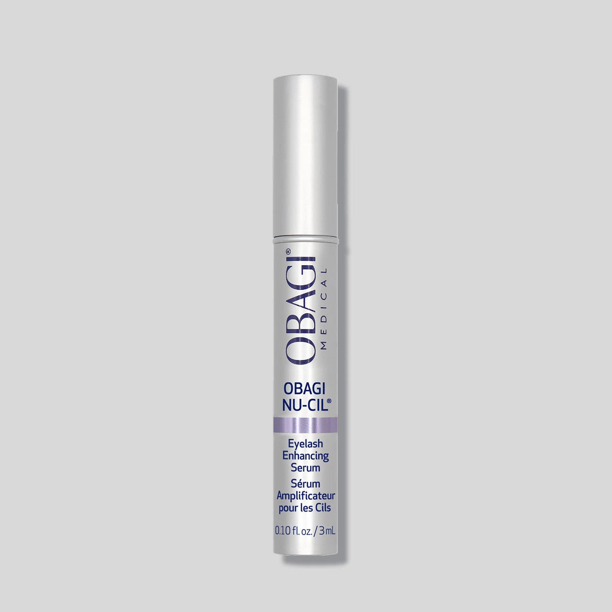 Obagi Nu-Cil eyelash enhancing serum in a 3ml tube, designed for eye, lash, and brow enhancement, with a sleek black applicator.
