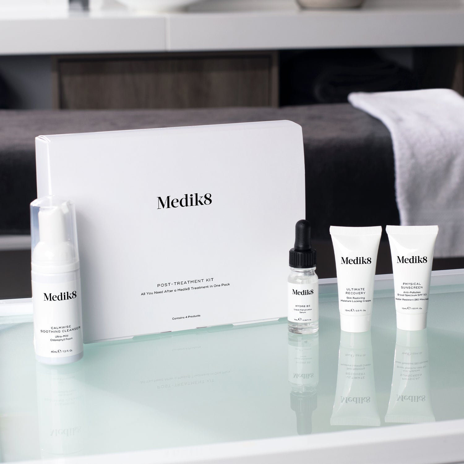 Medik8 Post-Treatment Skincare Kit with essential products for skin recovery and barrier repair, featuring skincare bottles and tubes.