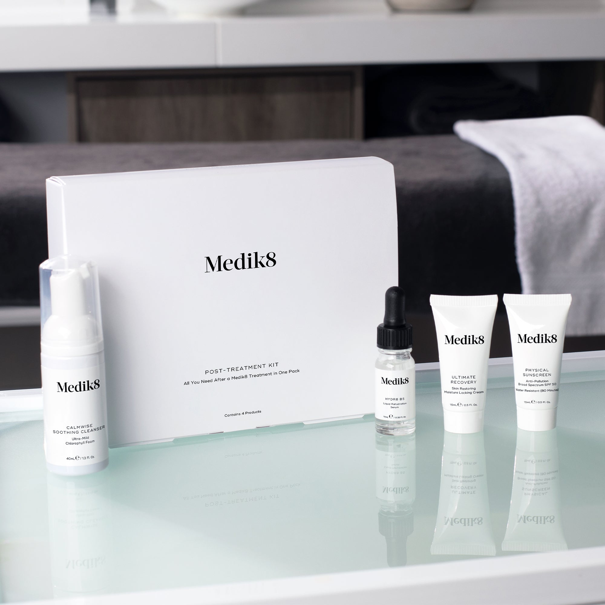 Medik8 Post-Treatment Skincare Kit with essential products for skin recovery and barrier repair, featuring skincare bottles and tubes.