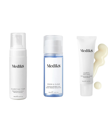 Medik8 Clarifying Skin Bundle with skincare products for clear, calm, and balanced skin in a complete routine setup.
