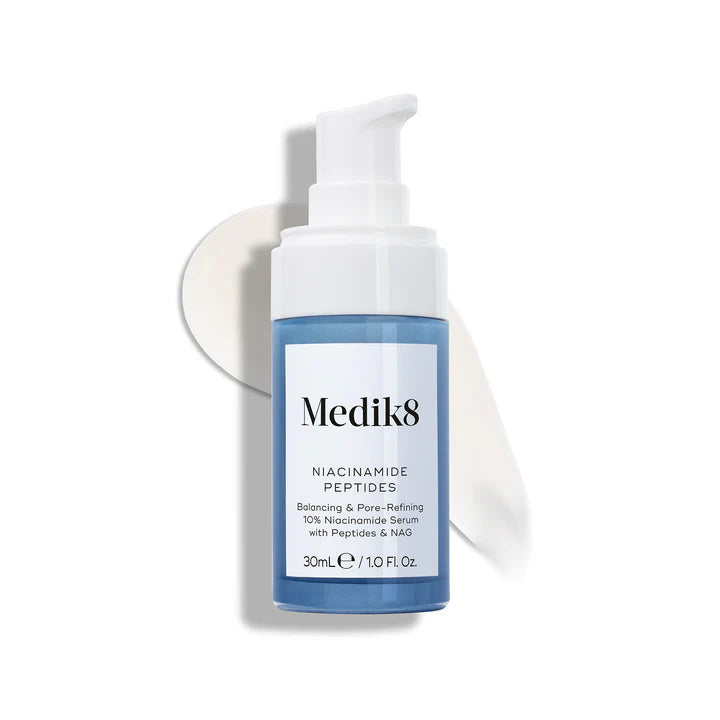 Medik8 Niacinamide Peptides serum in a 30ml bottle, featuring a clear liquid skincare formula with a pump dispenser.