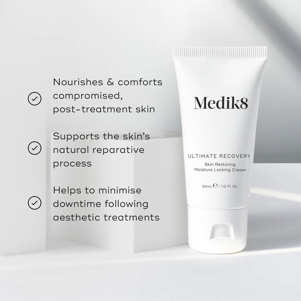 Medik8 Ultimate Recovery skin repair and barrier cream in a white jar with a blue lid, designed for intensive skin recovery.