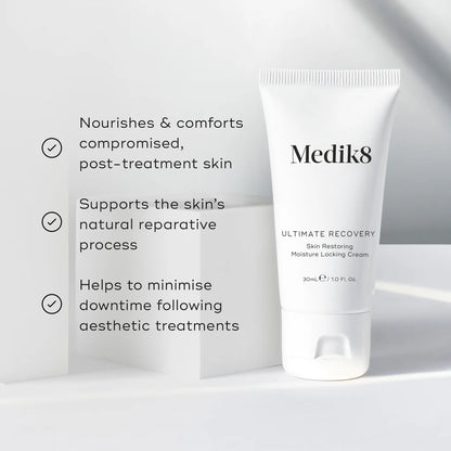 Medik8 Ultimate Recovery skin repair and barrier cream in a white jar with a blue lid, designed for intensive skin recovery.