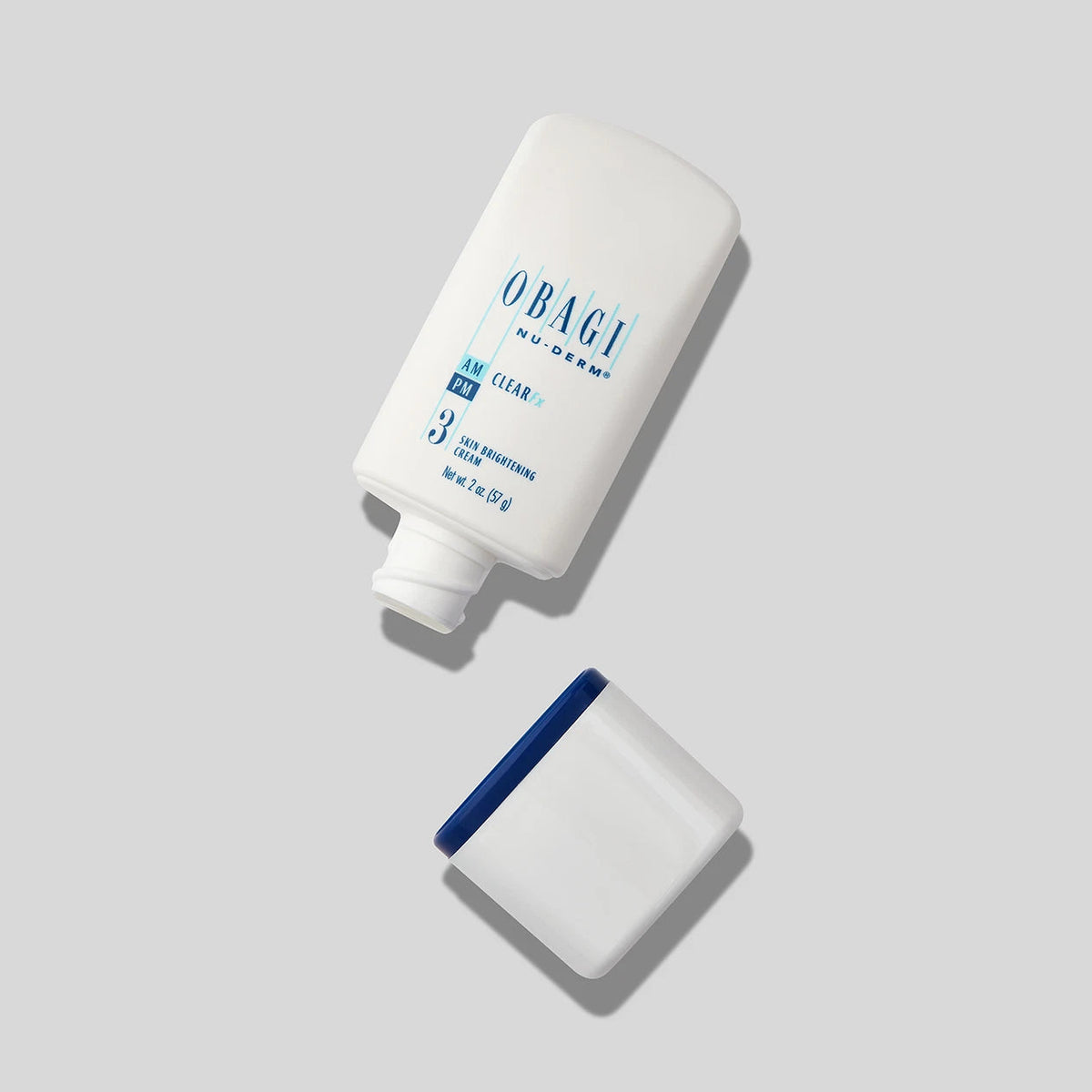Open jar of Obagi Nu-Derm 3 Clear FX skincare cream showing the smooth, light-colored product inside the container.