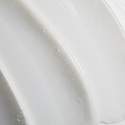Obagi Nu-Derm Exfoderm Forte skincare cream with a smooth, light texture in a white jar with a blue lid.