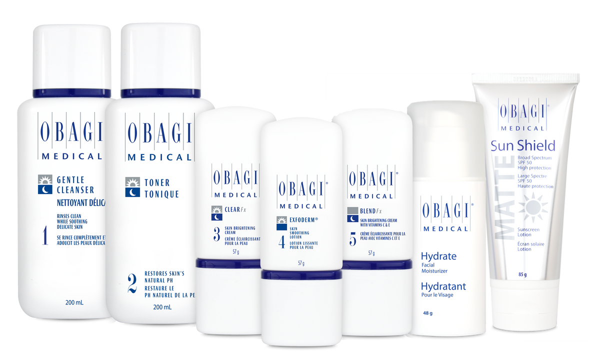 Obagi Nu-Derm Fx System for normal to dry skin, featuring skincare products in a complete range with bottles and jars, on a white background.