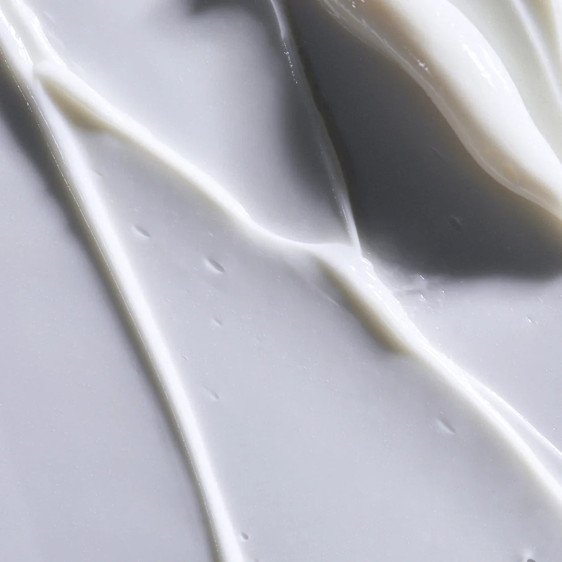 Obagi Rebalance Skin Barrier Cream in a jar, showcasing the skincare product designed to support and restore skin barrier health.