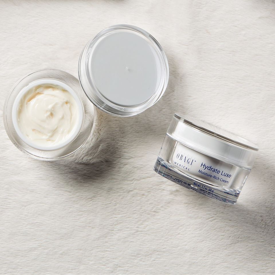 Obagi Hydrate Luxe skincare jar with 48g of moisturizing cream, featuring a sleek design and white packaging.